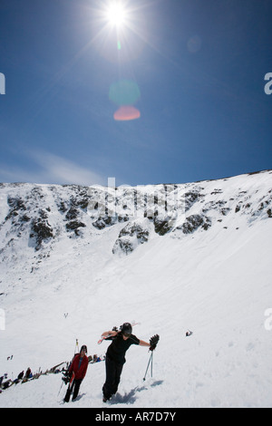 Skiers climbing Tuckerman Ravine in New Hampshire s White Mountains White Mountain National Forest April Stock Photo