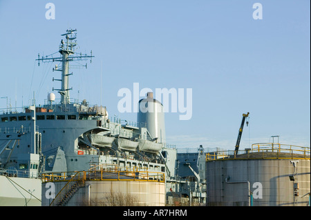 An oil storage depot and war ship in Birkenhead near Liverpool England Stock Photo