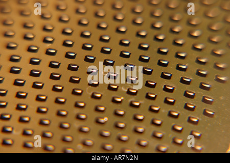 A fine grater for cheese and food as opposed to a coarse cheese grater A close up macro shot showing an abstract pattern Stock Photo