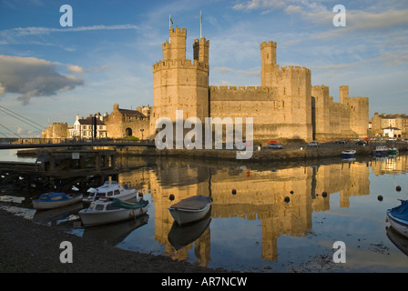 Sunset over Caernarfon Castle Caernarfon Gwynedd North Wales Stock Photo