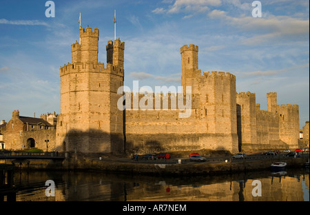 Sunset over Caernarfon Castle Caernarfon Gwynedd North Wales Stock Photo