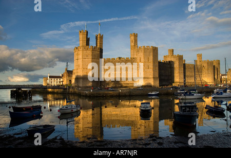 Sunset over Caernarfon Castle Caernarfon Gwynedd North Wales Stock Photo