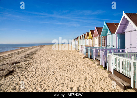 THE NEW BEACH HUTS AT WEST MERSEA ESSEX ALL PAINTED IN PASTEL COLOURS Stock Photo
