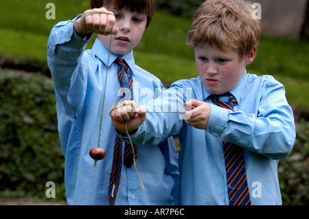 boys playing conkers Stock Photo