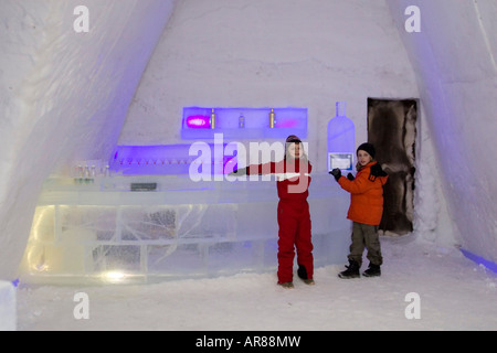 Young children in winter clothes in an ice bar in Norway Stock Photo