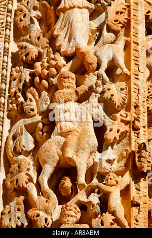 Ornately sculpted pillar with figures from the Dionysian procession at the Basilica of Severus Leptis Magna Libya Stock Photo