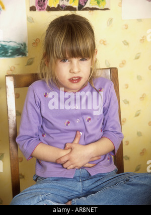 Young girl with tummy ache Stock Photo
