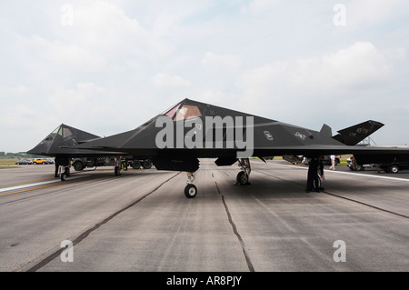 Two F-117 Nighthawk Stealth Fighters on a tarmac Stock Photo