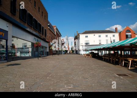 Empty market stalls with flowers in foreground Chesterfield Market, Chesterfield,Derbyshire,England Stock Photo