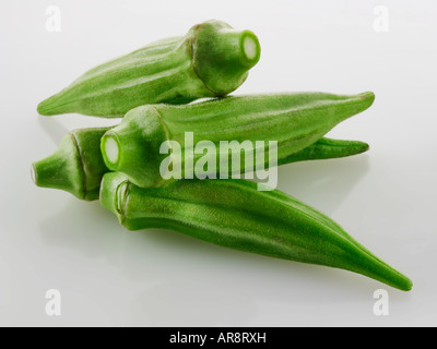 Fresh Ochra, Bhindi or Ladies Fingers whole and uncooked against a white background for cut out Stock Photo