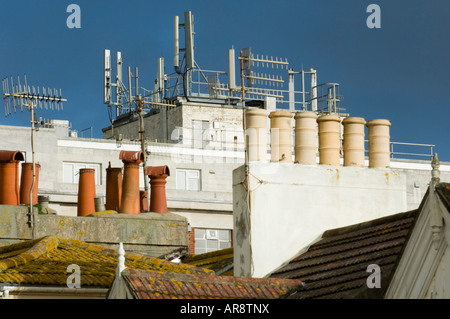 Mobile phone masts on the roof of a building in Western Road Brighton UK Stock Photo