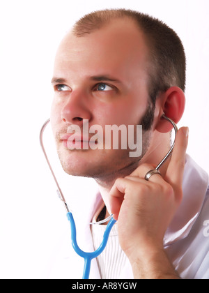 Young doctor using a stethoscope and smiling Stock Photo