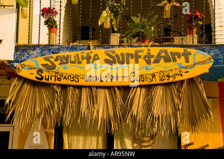 Mexico Riviera Nayarit Village of Sayulita near Puerto Vallarta on the Pacific Ocean  surf board sign and shop on Main Street Stock Photo