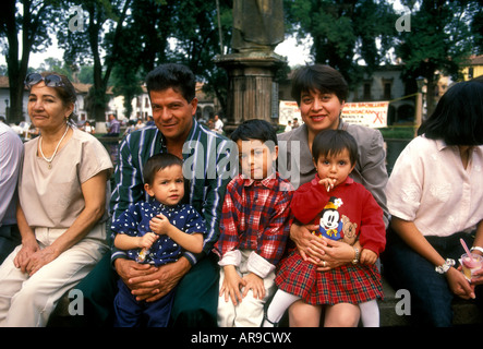 Mexicans, Mexican people, Mexican family, mother, father, children, tourists, Plaza Vasco de Quiroga, town of Patzcuaro, Michoacan State, Mexico Stock Photo