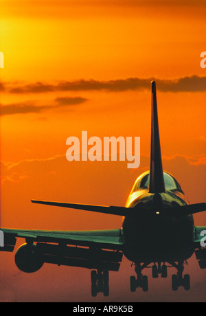 Boeing 747 jumbo jet airliner landing at sunset Stock Photo