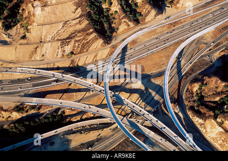 aerial view of traffic on freeway complex junction of motorways roads spaghetti like southern California Los Angeles in rocky de Stock Photo