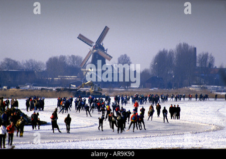 The Elfstedentocht 200 Kilometer, Kilometre, ice skating race along the frozen canals of Friesland in Holland. Seen here in 1986 Stock Photo