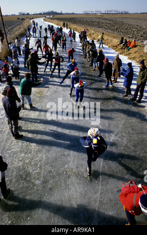 The Elfstedentocht 200 Kilometer, Kilometre, ice skating race along the frozen canals of Friesland in Holland. Seen here in 1986 Stock Photo