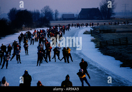 The Elfstedentocht 200 Kilometer, Kilometre, ice skating race along the frozen canals of Friesland in Holland. Seen here in 1986 Stock Photo