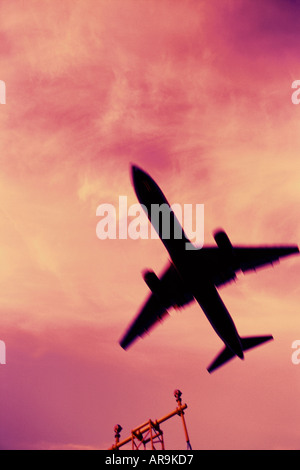 Boeing 767 jumbo jet generic airliner silhouette in the air, cross processed Stock Photo