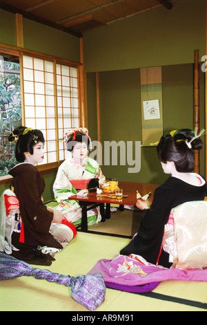 Maiko-san or Geishas in a tea house in Tokyo, Japan Stock Photo