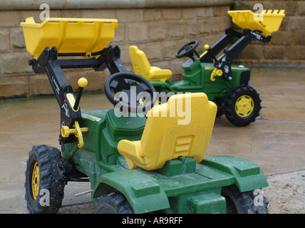 Childrens Toy Tractors in the Wet at Alnwick Gardens Northumberland England United Kingdom UK Stock Photo