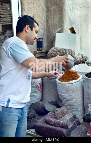 Dubai, United Arab Emirates, UAE, Traditional Spice Souk 'Shopping Center' (Near the Creek) Detail Spices sold in Bulk Arabian Man, Clerk Stock Photo