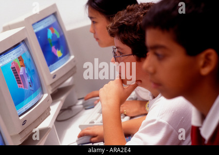 Multiracial junior middle school students in school computer class Stock Photo