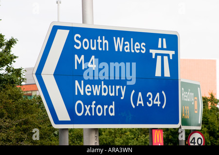 Directional road sign on Junction 11 of the M4 motorway in Reading Berkshire pointing down the west bound slip road to Newbury Stock Photo