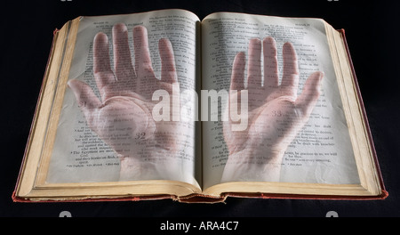 Hands Praying With Bible Stock Photo