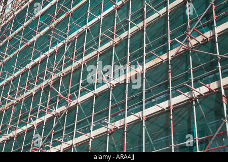 University Campus Suffolk building under construction with scaffolding and safety netting, Ipswich Wet Dock, Suffolk, England Stock Photo