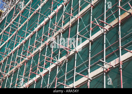 University Campus Suffolk building under construction with scaffolding and safety netting, Ipswich Wet Dock, Suffolk, England Stock Photo