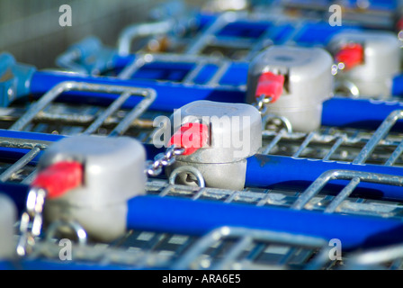 Close up picture of the coin operated locking mechanism for shopping trolleys. Stock Photo