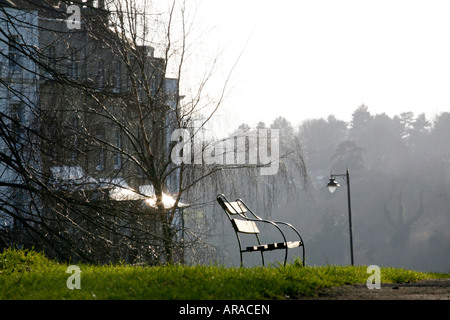 A park bench looking across the Avon Gorge by Brunel's historic Suspension bridge in Clifton Bristol U.K. Stock Photo