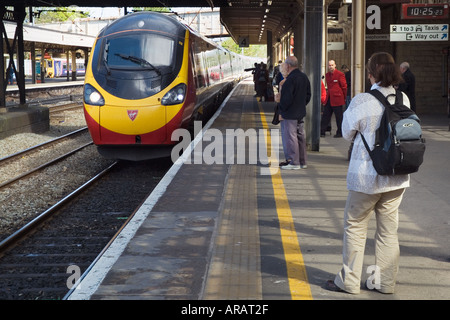 Virgin Pendolino train arriving at Lancaster on the West Coast Main Line Stock Photo