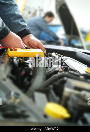 mechanics working in garage, norfolk, england Stock Photo