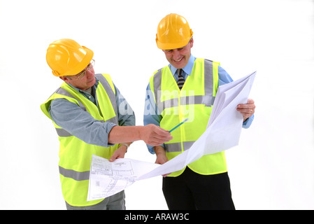 construction workers looking at plans Stock Photo