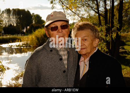 Old couple. Autumn. Sunshine. Stock Photo