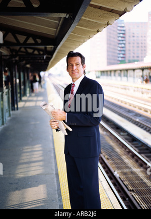 Businessman Waiting for Train Stock Photo