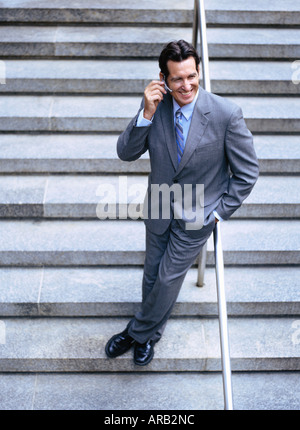Portrait of Businessman Using Cellular Telephone Stock Photo