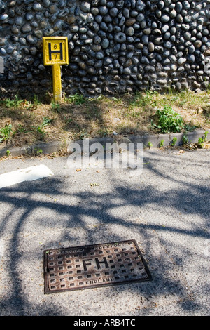 British fire hydrant and sign in Happisburgh Norfolk United Kingdom Stock Photo