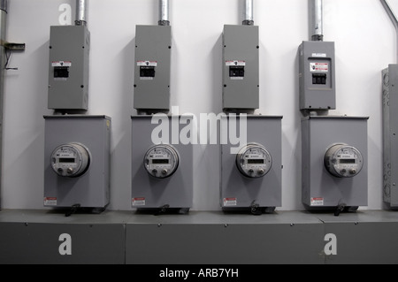 A bank of electric meters in an office building Stock Photo