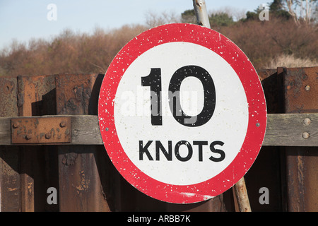 Red circular sign saying Ten Knots speed limit at mouth of River Deben Stock Photo