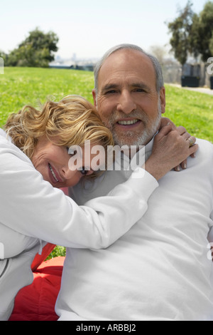 Couple Sitting Outdoors Stock Photo