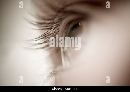 Close up of eye and eyelashes looking off in distance soft and fuzzy monochromatic Stock Photo