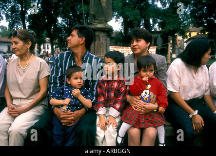 Mexicans, Mexican people, Mexican family, mother, father, children, tourists, Plaza Vasco de Quiroga, town of Patzcuaro, Michoacan State, Mexico Stock Photo