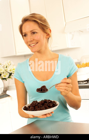 WOMAN EATING PRUNES Stock Photo