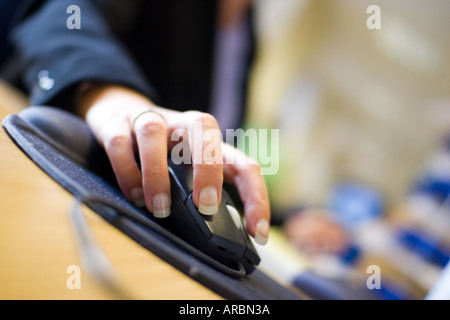 Female using computer in office hand on mouse Stock Photo
