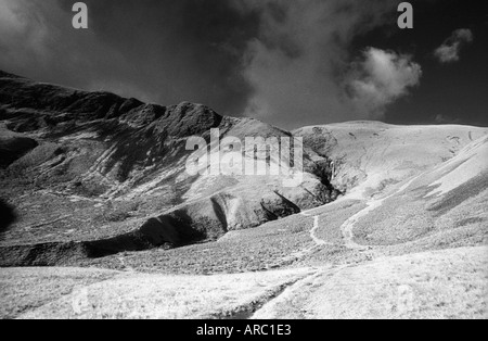 Black and white infrared image of Cautley Spout waterfall, Cumbria in the first snow of Winter Stock Photo