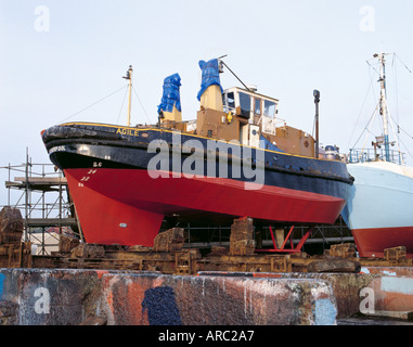 A tug with a Voith Schneider propulsion unit, in a ship repair yard, Grimsby, Humberside, North Lincolnshire, England, UK. Stock Photo